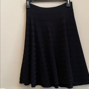 Flared black knit skirt